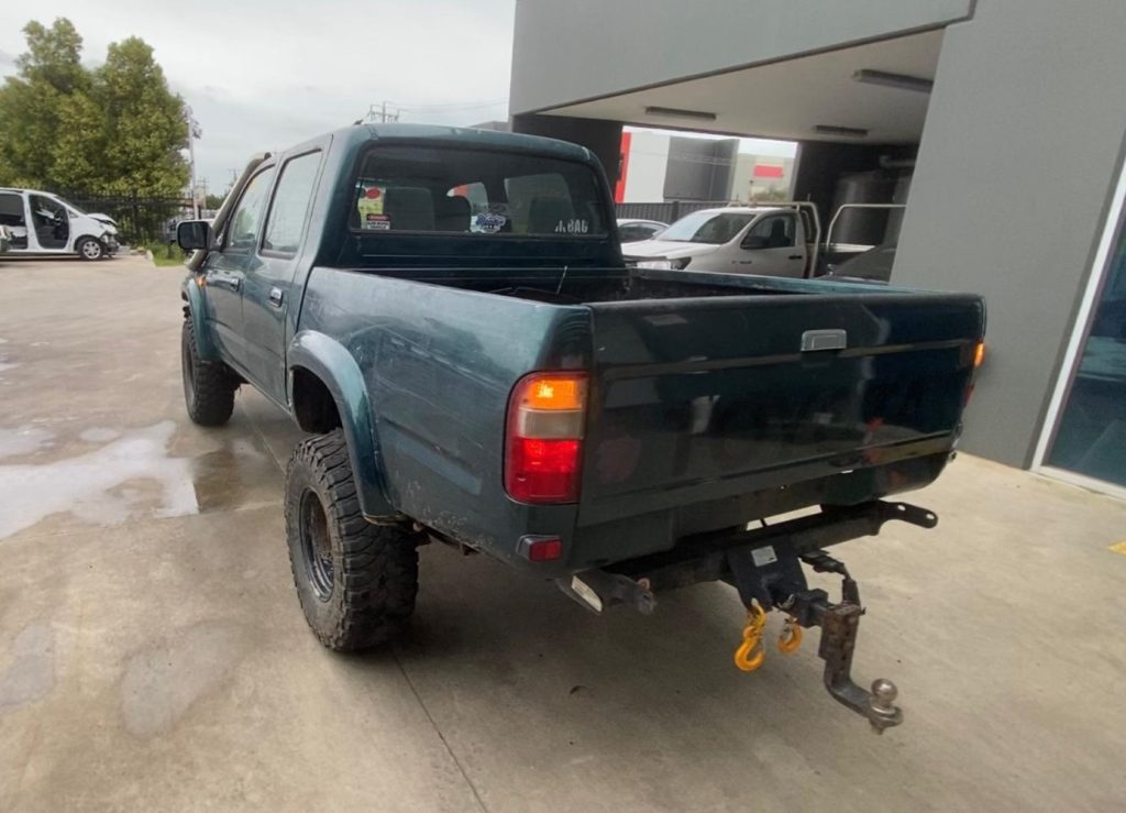 Car Wreckers - Toyota Hilux 2000 Green Manual Petrol