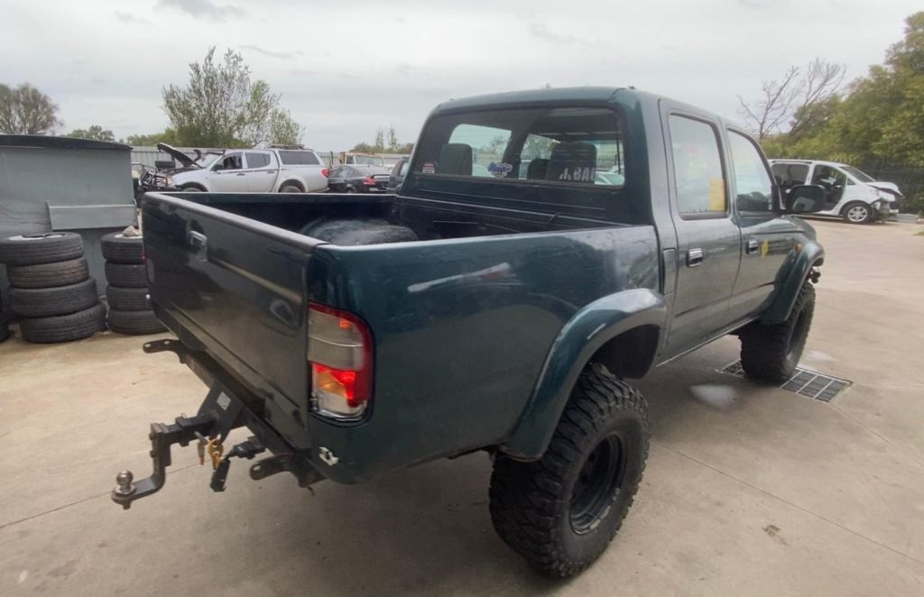 Car Wreckers - Toyota Hilux 2000 Green Manual Petrol