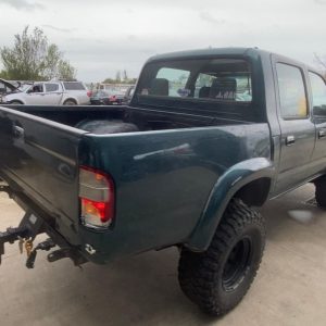 Car Wreckers - Toyota Hilux 2000 Green Manual Petrol