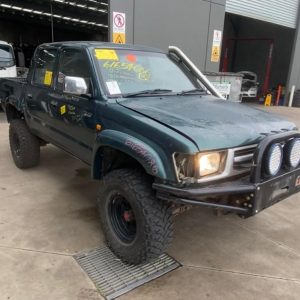 Car Wreckers - Toyota Hilux 2000 Green Manual Petrol