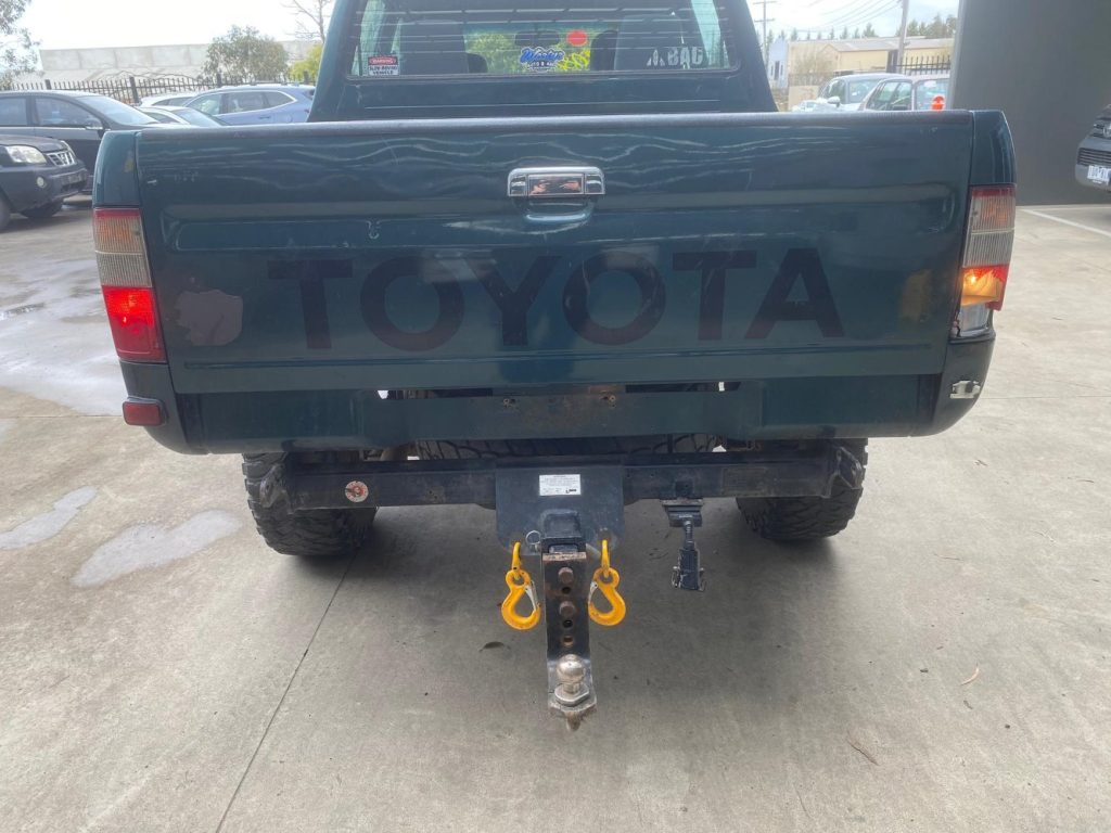 Car Wreckers - Toyota Hilux 2000 Green Manual Petrol