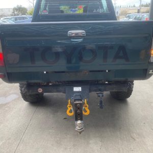 Car Wreckers - Toyota Hilux 2000 Green Manual Petrol