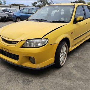 Car Wreckers - Mazda 323 2001 Yellow Auto Petrol