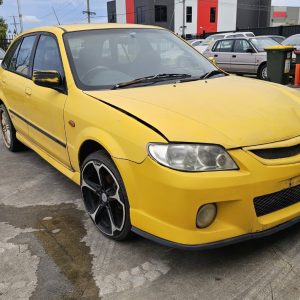 Car Wreckers - Mazda 323 2001 Yellow Auto Petrol
