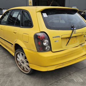 Car Wreckers - Mazda 323 2001 Yellow Auto Petrol