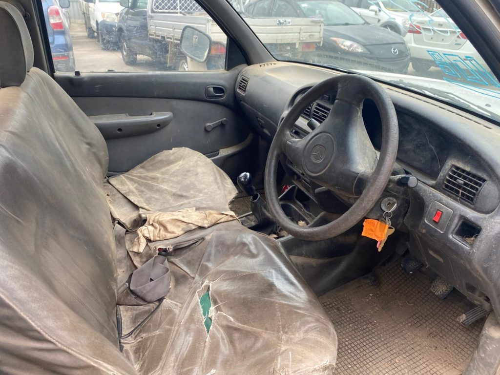 Car Wreckers - Mazda Bravo 2002 White Auto Petrol