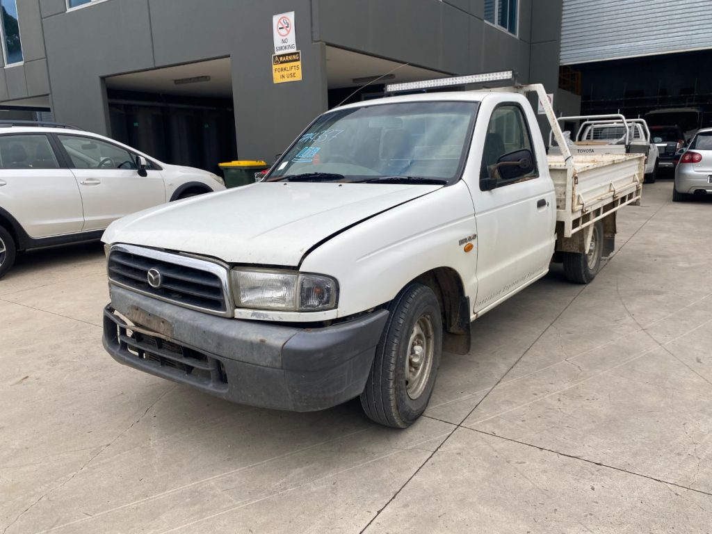 Car Wreckers - Mazda Bravo 2002 White Auto Petrol