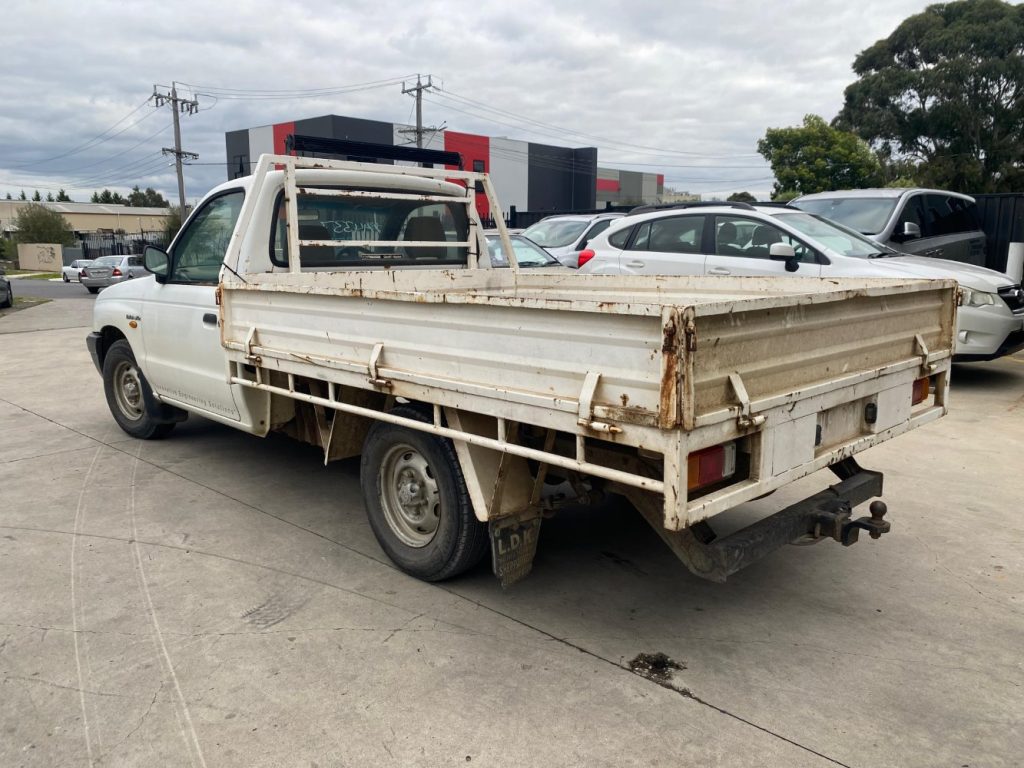 Car Wreckers - Mazda Bravo 2002 White Auto Petrol