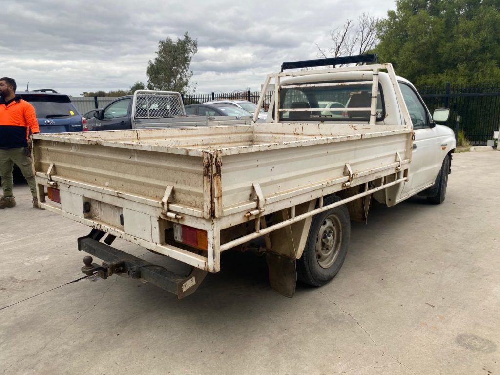 Car Wreckers - Mazda Bravo 2002 White Auto Petrol