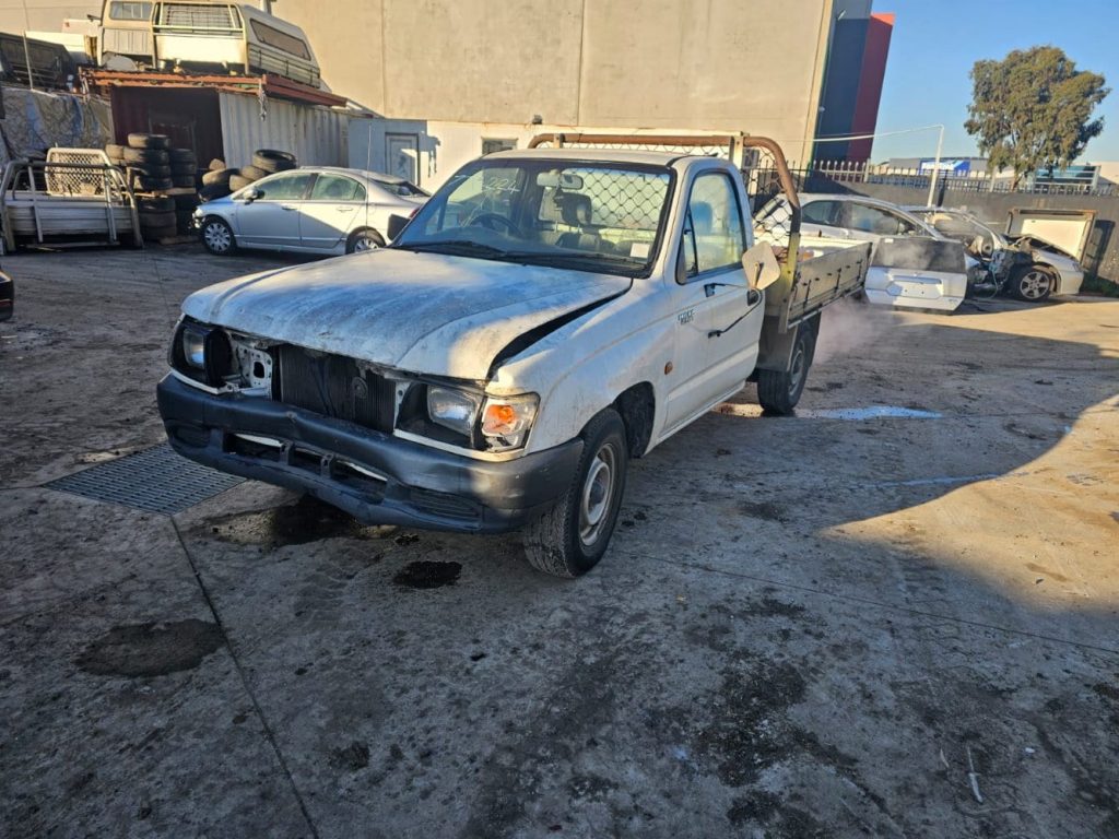 Car Wreckers - Toyota Hilux 2002 White Manual Petrol
