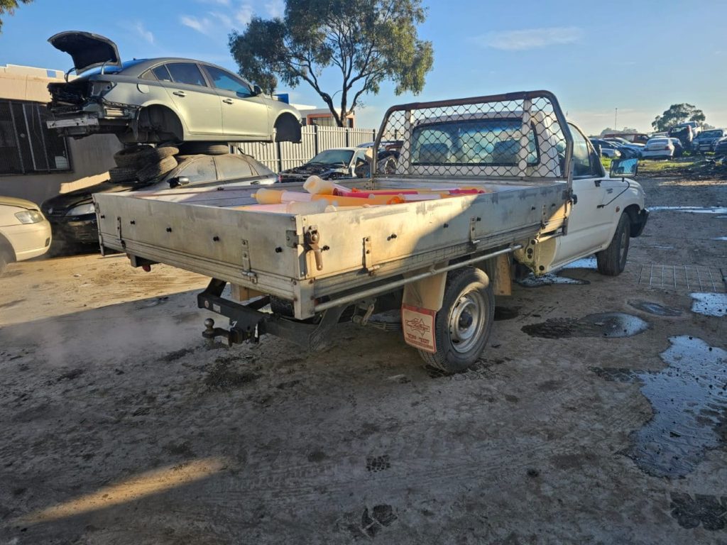 Car Wreckers - Toyota Hilux 2002 White Manual Petrol