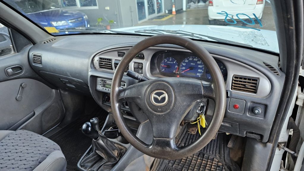 Car Wreckers - Mazda Bravo 2003 White Auto Petrol