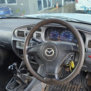 Car Wreckers - Mazda Bravo 2003 White Auto Petrol