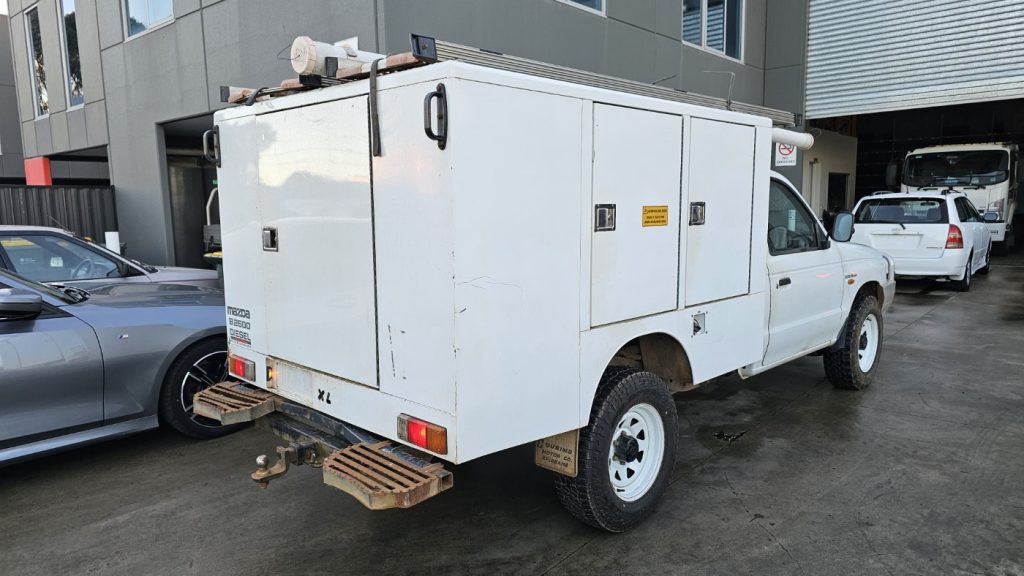 Car Wreckers - Mazda Bravo 2003 White Auto Petrol