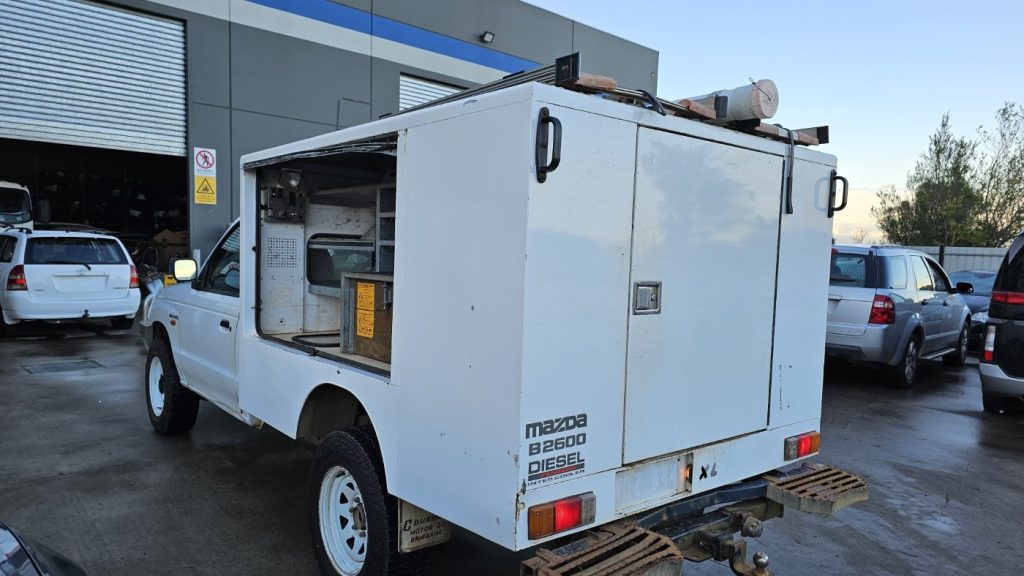 Car Wreckers - Mazda Bravo 2003 White Auto Petrol