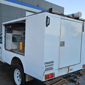 Car Wreckers - Mazda Bravo 2003 White Auto Petrol