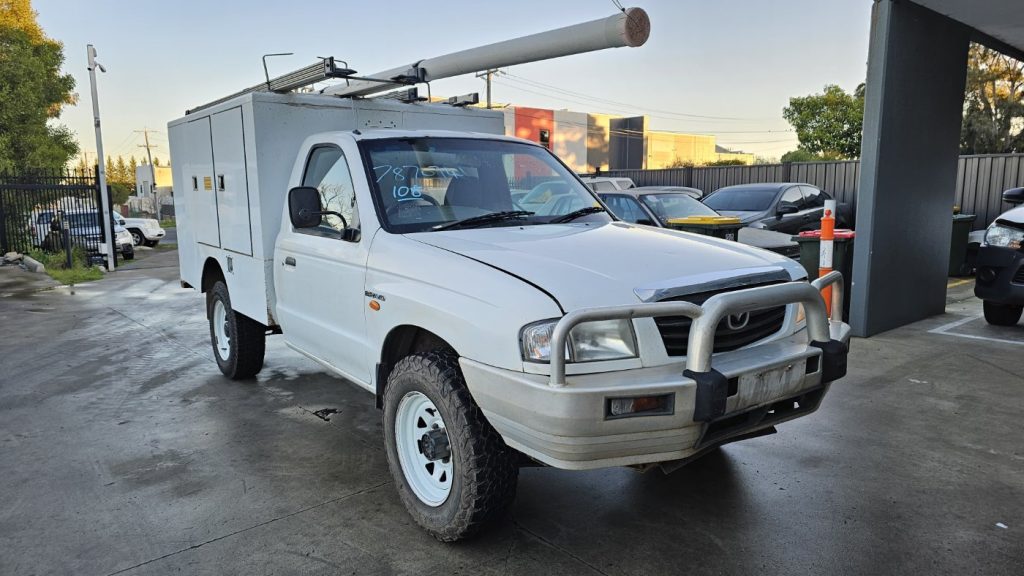 Car Wreckers - Mazda Bravo 2003 White Auto Petrol