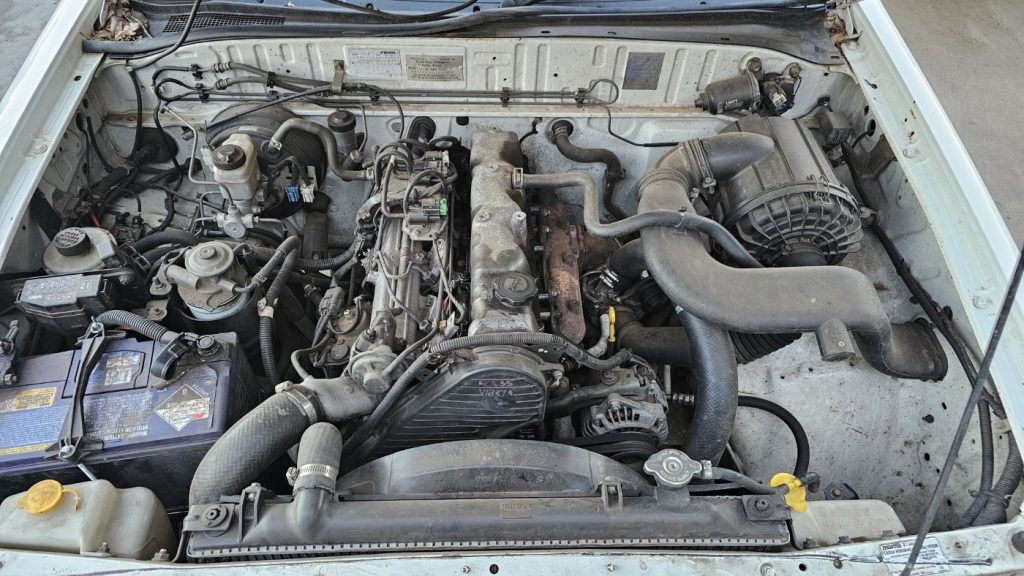 Car Wreckers - Mazda Bravo 2003 White Auto Petrol