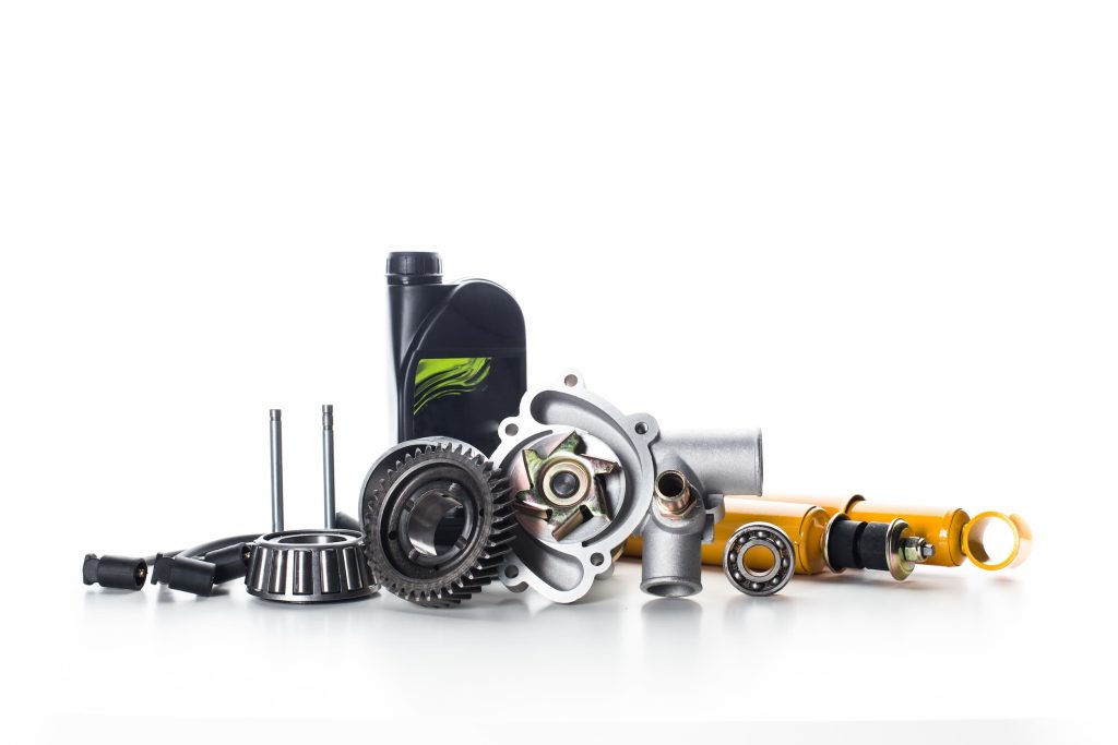 Automotive parts and components displayed neatly on a white background.