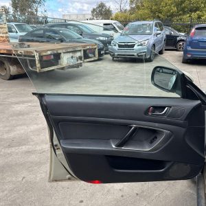 SUBARU OUTBACK 4TH GEN 07/2003-09/2009 LEFT FRONT DOOR TRIM GREY CLOTH