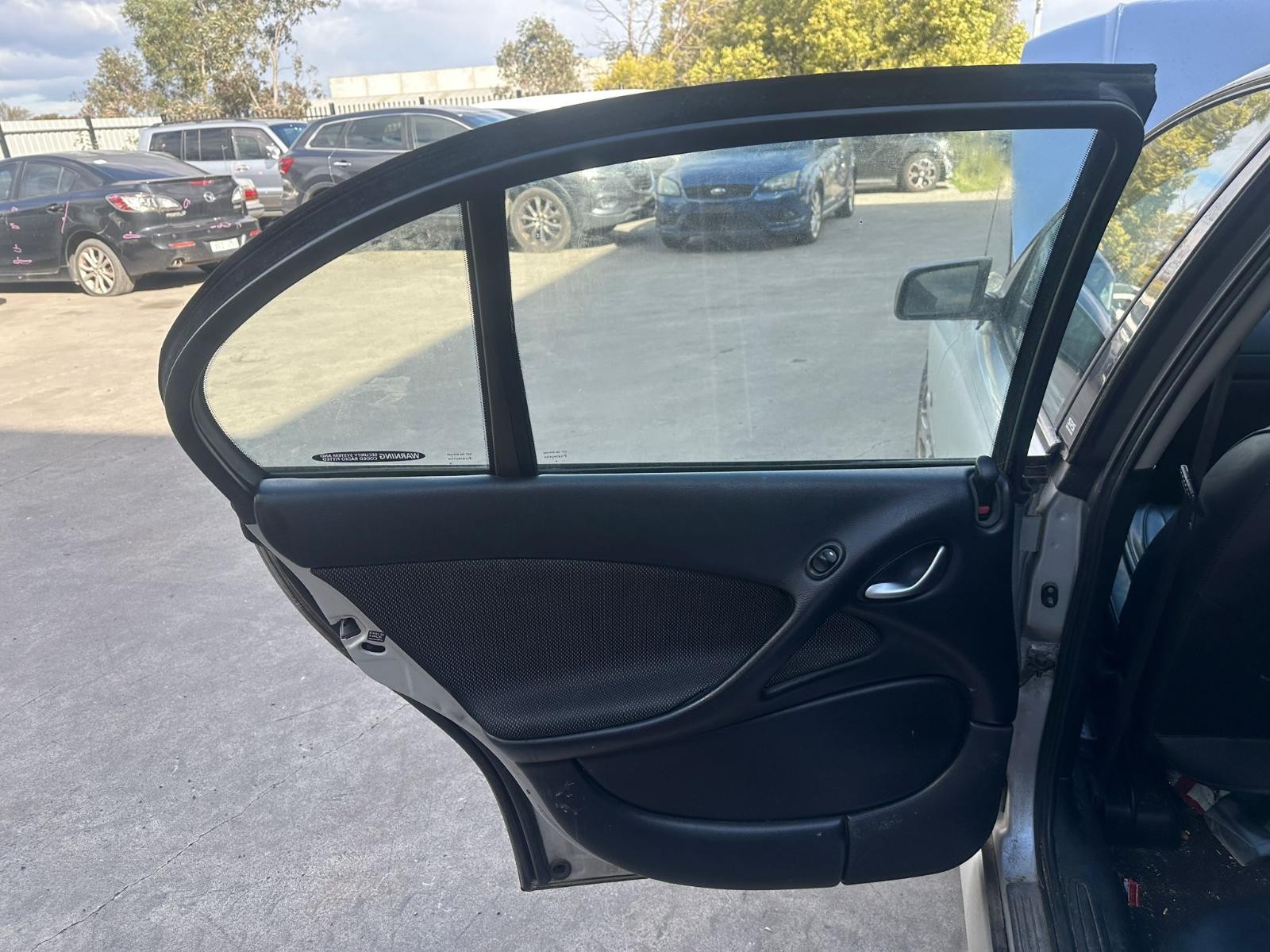 HOLDEN COMMODORE 2002-2007 DOOR TRIM LH REAR, VY1-VZ, LEATHER, 10/02-09/07