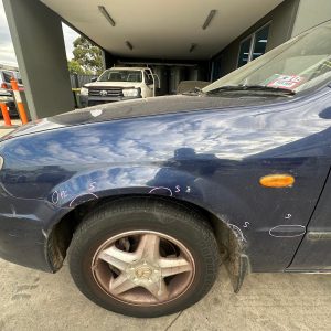 MAZDA 323 BJ 03/2001-12/2003 LEFT GUARD NON SKIRT TYPE