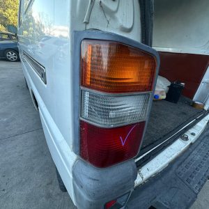 MITSUBISHI L300 SJ-SK 09/1994-12/2013 LEFT TAILLIGHT BLACK SURROUND MB527317