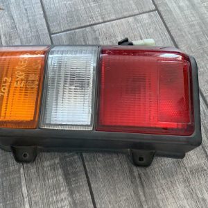 MITSUBISHI L300 RIGHT TAILLIGHT SJ-SK, BLACK SURROUND, 09/94-12/13 94 95 96 97 9