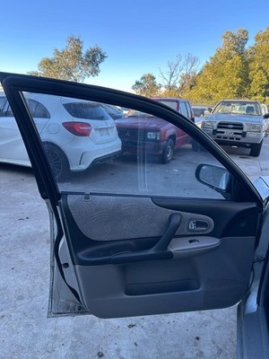 FORD LASER KQ 04/2001-09/2002 LEFT FRONT DOOR TRIM LXi TYPE SEDAN