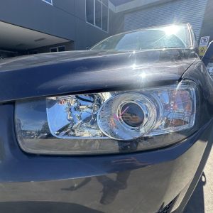 HOLDEN CAPTIVA 7 CG 01/2011-09/2015 LEFT HEADLAMP BLACK SURROUND 95413294