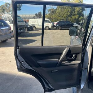 MITSUBISHI PAJERO NP 11/2002-09/2006 LEFT REAR DOOR TRIM BLACK LEATHER